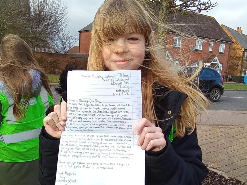 Amy with her letter to the Manager of Mawsley's One Stop