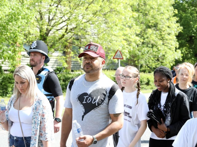 Off the Streets NN members on the march to OG's sports ground for a community day