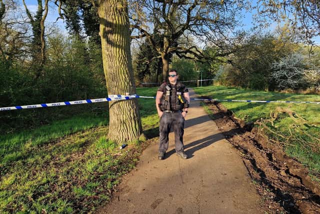 Police guard woodland in Corby after a teenager was shot/National World