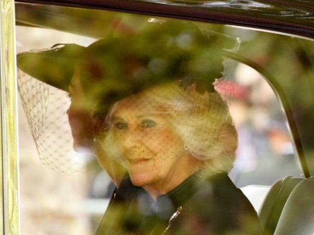 Camilla, the Queen Consort, sits in a car heading towards Westminster Abbey