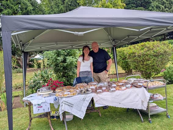 Our residents families lending at hand on our cake stall.