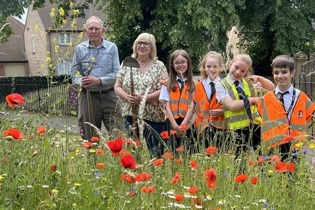 Carol and Brian from Friends of St Mary's with Junior school pupils Olivia, Lucy, Miley and Alfie