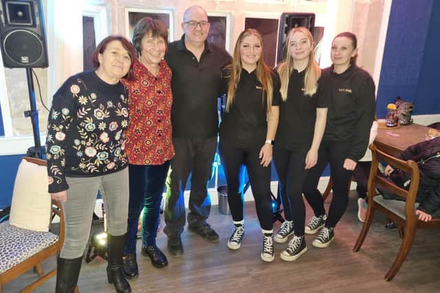 Tony Bagshaw with the staff celebrating decade of Kafe Bloc