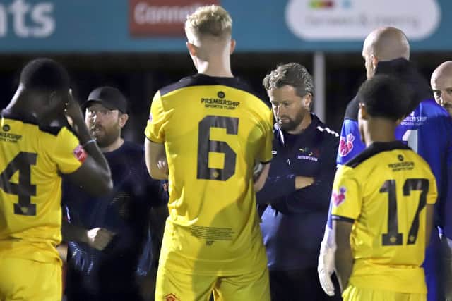 Nick Green (left) and David Bridgwater chat to the Kettering team after Tuesday's draw (Picture: Peter Short)