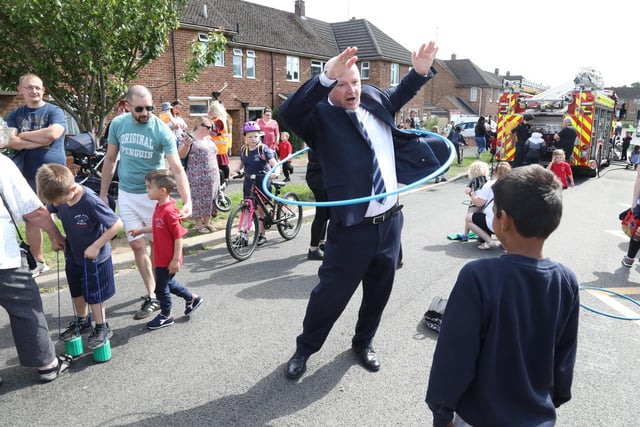 Mr Chris Latimer, head teacher of Grange Primary Academy has a go at hula-hooping