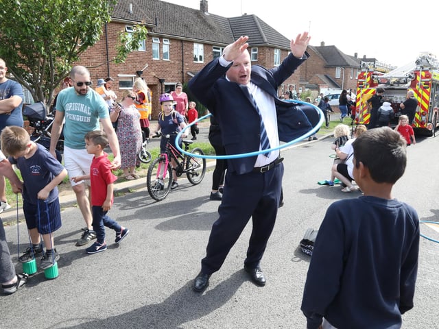 Mr Chris Latimer, head teacher of Grange Primary Academy has a go at hula-hooping