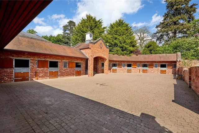 The home has traditional features as well as an indoor swimming pool, equestrian facilities and extensive parkland.