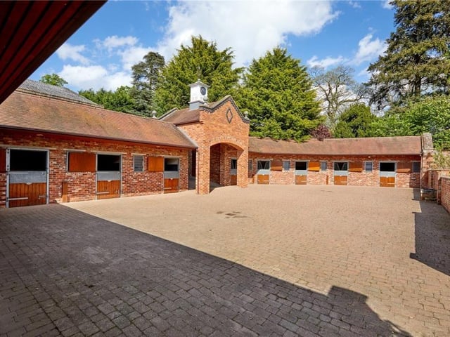 The home has traditional features as well as an indoor swimming pool, equestrian facilities and extensive parkland.