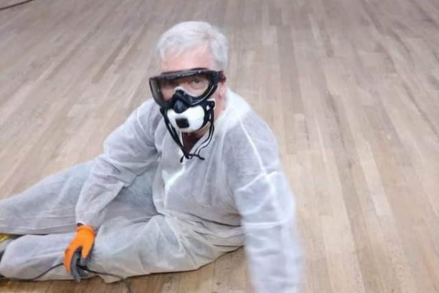 Cllr Reuby during the Main Hall floor renovations