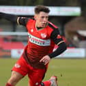 Frankie Maguire heads off to celebrate after he scored the only goal of the game to give Kettering Town a 1-0 win over Brackley Town. Pictures by Peter Short