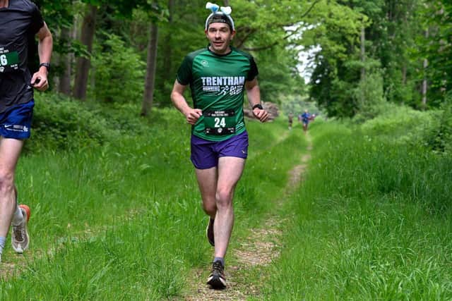 Runners head through the woods on the Trail Mix Challenge
