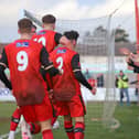 The Kettering Town players and fans celebrate Frankie Maguire's winning goal in the 1-0 success over Brackley Town. Picture by Peter Short