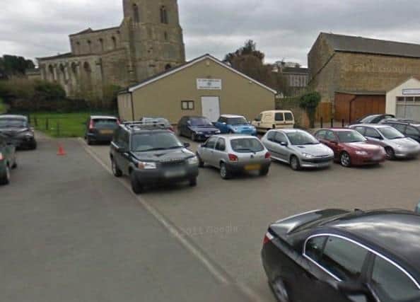 This small building and car park in Thrapston are going up for sale