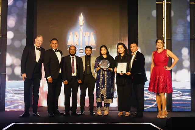 Staff at Nazreen celebrate with their award.