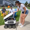 Students with a  Starship robot : Picture Starship Technologies