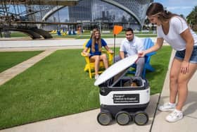 Students with a  Starship robot : Picture Starship Technologies