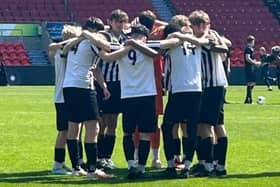 The Corby Town Academy U15s players on the pitch at Doncaster Rovers. Image: Corby Town Academy U15s