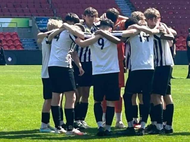 The Corby Town Academy U15s players on the pitch at Doncaster Rovers. Image: Corby Town Academy U15s