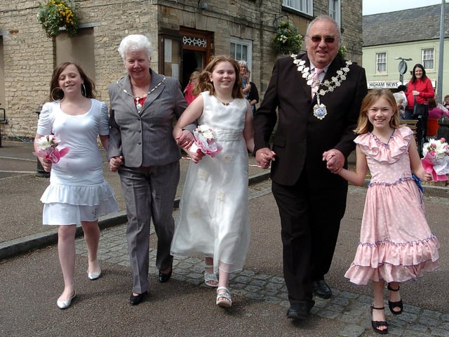 Higham Ferrers Market Square May Day: Mayor and Mayoress of Higham with the May Queen Court l-r Samantha Ellis 11, Eloise Hoskins (Queen) 9, and Jade Reading 9, in 2008