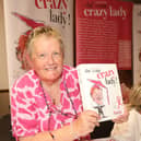 Glennis Hooper with her book 'She's One Crazy Lady'