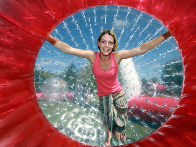Ingrid Justice in a Zorb at Corby's Highland Gathering funfair