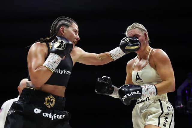 Chantelle Cameron punches Mikaela Mayer during their super-welterweight title fight