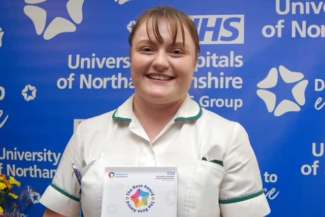Beth Tooms with her award.