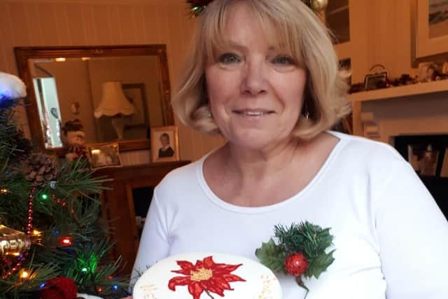 Baker Alison Wilkinson with the celebration cake that will make someone's Christmas more special