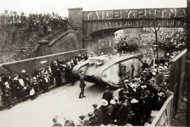 At the end of the First World War, a tank arrives in Rushden. It is seen here in 1919 or 1920 underneath the bridge which used to stand near where Asda is today