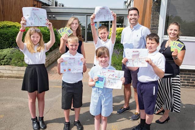 Alexis Webb-Stranaghan (front centre) celebrates with classmates, Assistant Principal Liam Benner and Belvoir representatives Mia Tansur (back left) and Kasia Sobczyk-Dybul (far right)