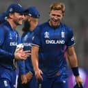 David Willey and skipper Jos Buttler were all smiles after the Northants man claimed three wickets in England's World Cup win over Pakistan on Saturday (Photo by DIBYANGSHU SARKAR/AFP via Getty Images)