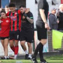 A dazed Blaine Rowe is helped off the field after his early collision with the Worcester City goalkeeper (Picture: Peter Short)
