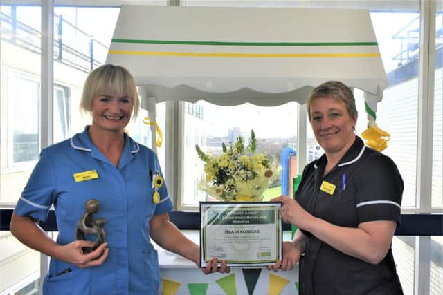 Staff Nurse Beata Kotcecke presented with her award by Chief Nursing Officer Jayne Skippen