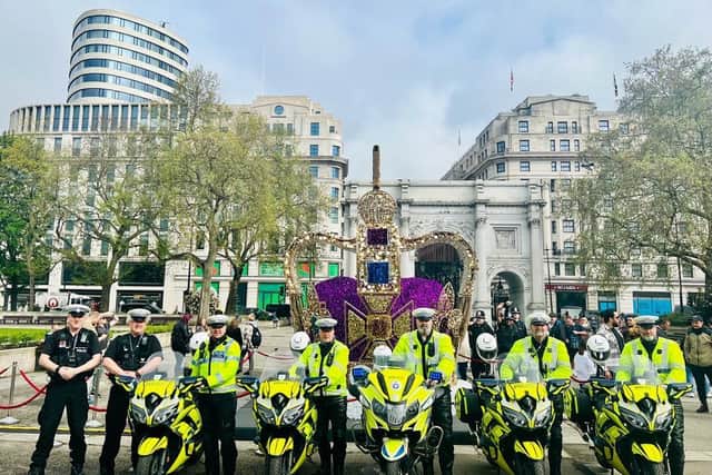 Special escort trained officers from Northamptonshire Police and Derbyshire Police beside a Coronation-themed installation at Marble Arch.