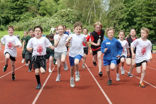 Pupils from schools covering the Welland Valley area, Corby, take part in an Olympics-themed sports day event at the running track 2012.
