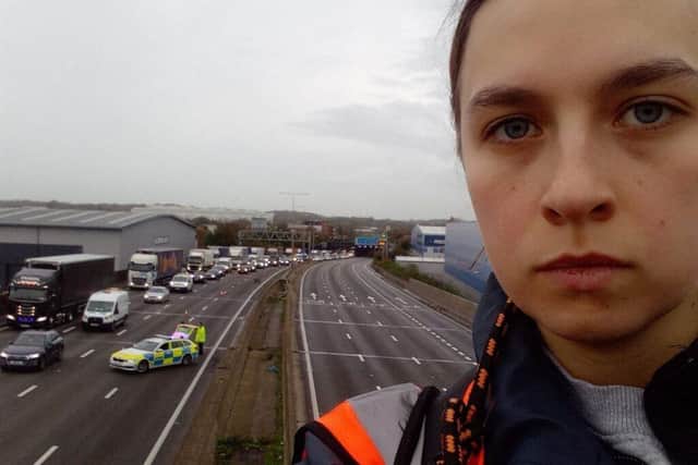 A Just Stop Oil protestor posted this selfie from the top of a gantry over the M25 on Monday (November 7)