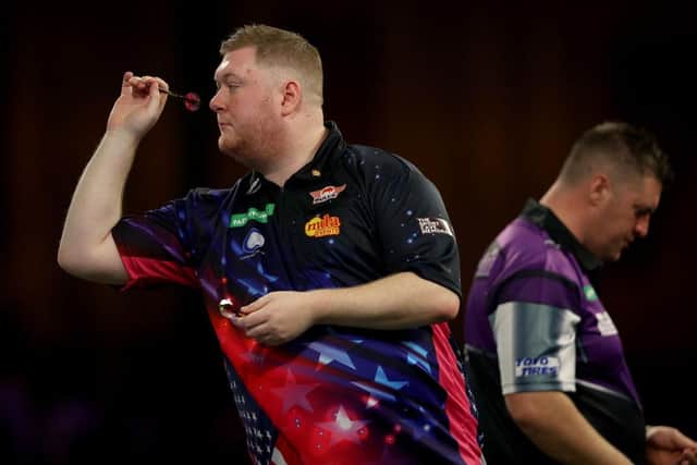 Ricky Evans in action against Daryl Gurney (Picture: Tom Dulat/Getty Images)