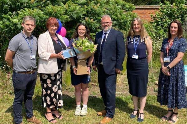 Jess Day celebrates her award with The Bedford College Group CEO, Yiannis Koursis OBE, and her colleagues from Shuttleworth College.