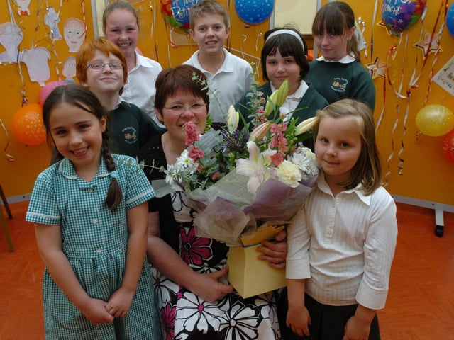Corby Old Village School head retirement - Georgina Dredge with pupils who have thrown her a party to celebrate her retirement. Harry Toseland, Isla Russell, Georgina Reay, Jade Andrew, Ellie Campbell, Finlay Cooney, Chloe Holman, and Carly Byrne, 2008