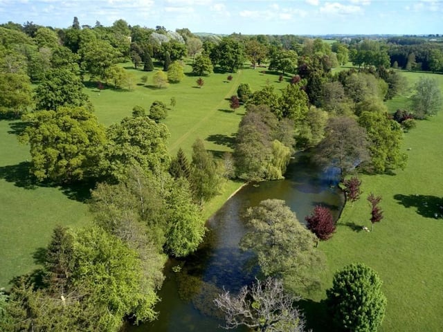 The home has traditional features as well as an indoor swimming pool, equestrian facilities and extensive parkland.