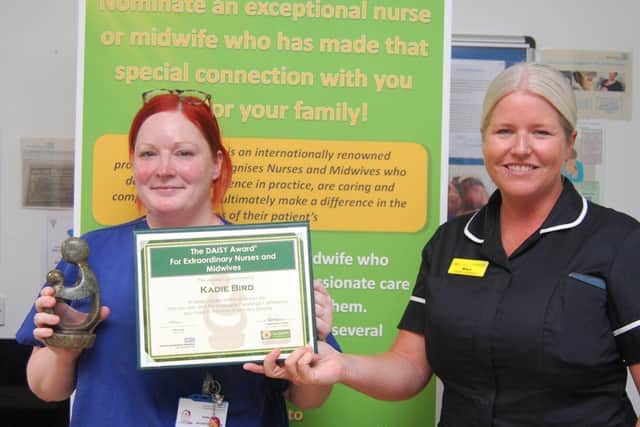 Midwife Kadie Bird is presented with her award by Director of Midwifery Mara Tonks