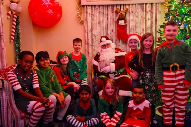 The little elves were surprised to see Father Christmas in the homes sensory Santa's Grotto