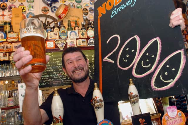 Kettering Alexandra Arms 2,000th pint  Nip Thornley behind the bar in February 2006