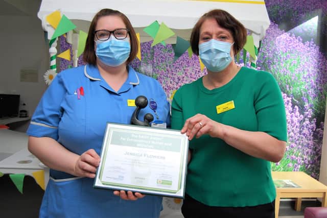 KGH ICU staff nurse Jessica Flowers receives the award from Director of Nursing and Quality Jayne Skippen