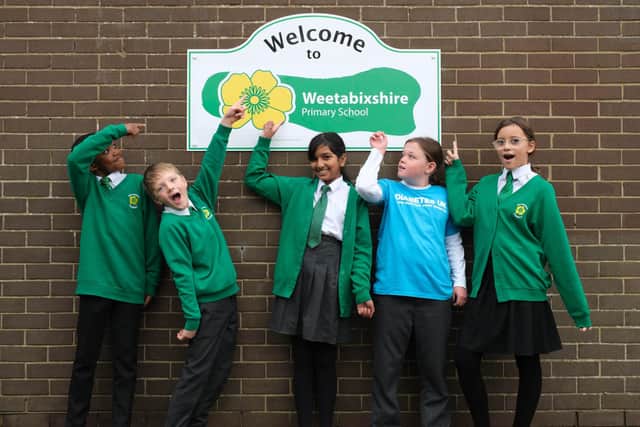 Meadowside Primary school pupils (left to right) Junior, Theo, Esha, Lily, and Isabelle in front of a ‘Welcome to Weetabixshire’ sign which has been erected in the Northamptonshire town of Burton Latimer to mark the new proposed county lines of Weetabixshire (Photo credit: Michael Leckie/PA Wire)