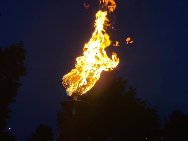 The beacon is lit at Corby's ceremony