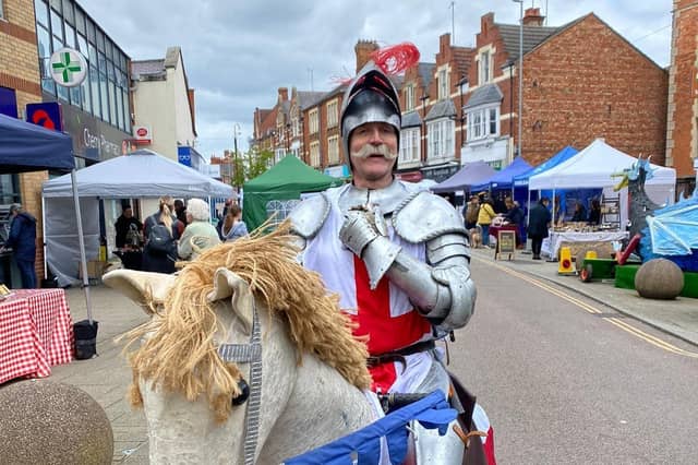 People attend Rushden's St George's Day market on Saturday