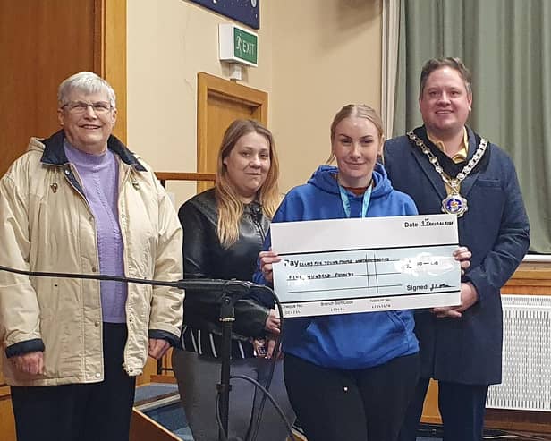 Rothwell Ladies Thursday Club former chairperson Joy Allen and Mayor of Rothwell Cllr Ash Davies present the cheque to Rothwell Youth Club/Rothwell Ladies Thursday Club