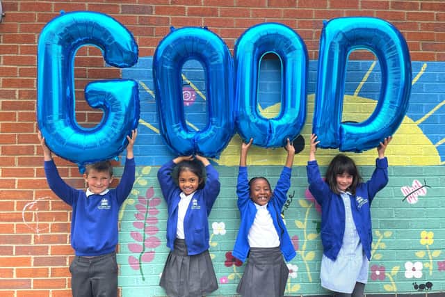 Pupils celebrate the school's grade of good.