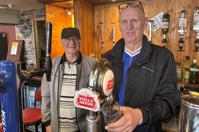 James (right) with his father-in-law John Creek who has been helping him out behind the bar. Image: National World